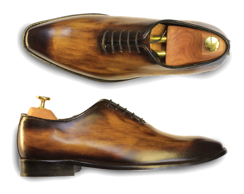 Hand-burnished wholecut oxfords with shoe trees.