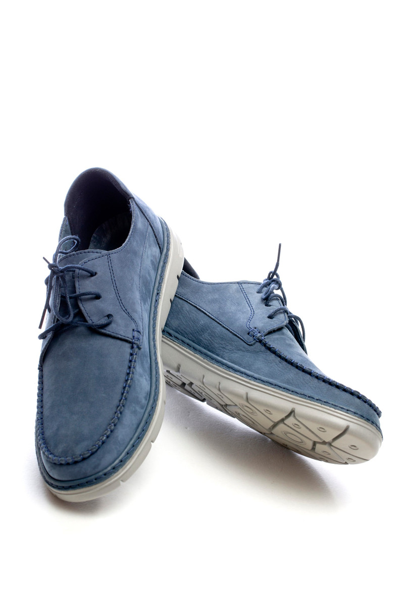 Blue suede moccasin-toe lace-ups on a white sole.
