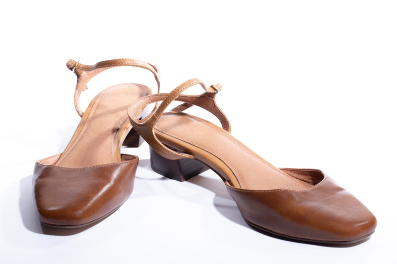 Tan square-toe slingbacks on a low block heel.